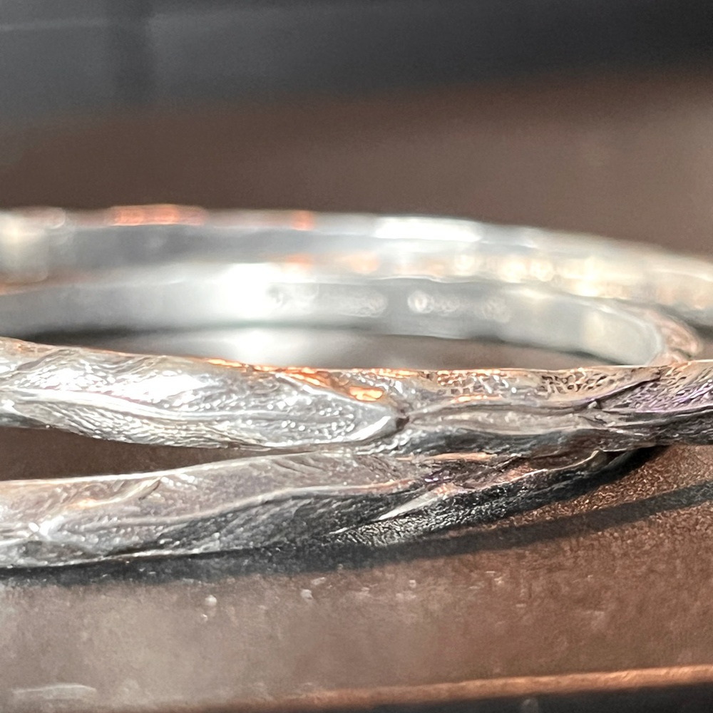 Kirk & Son Sterling Silver Repousse numbered vine bangle bracelets.